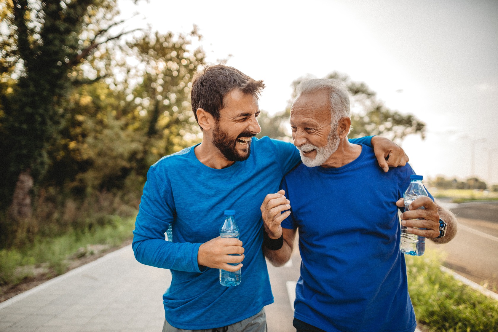 Younger man with arm around older man