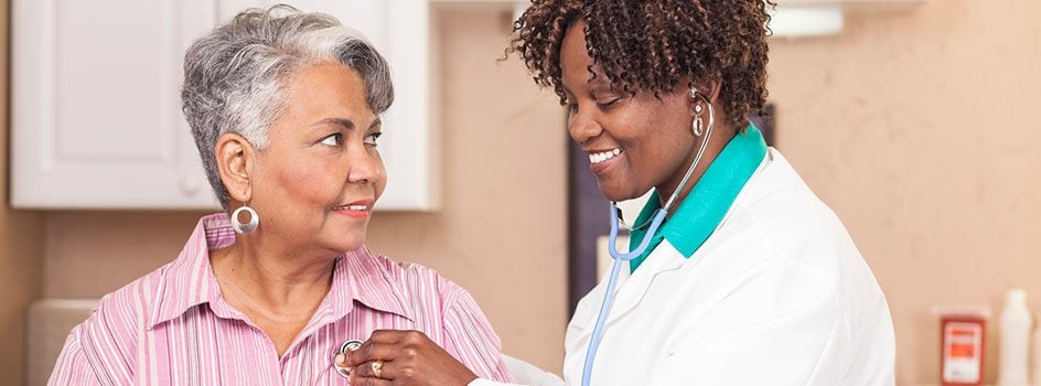 doctor listening to patients heart