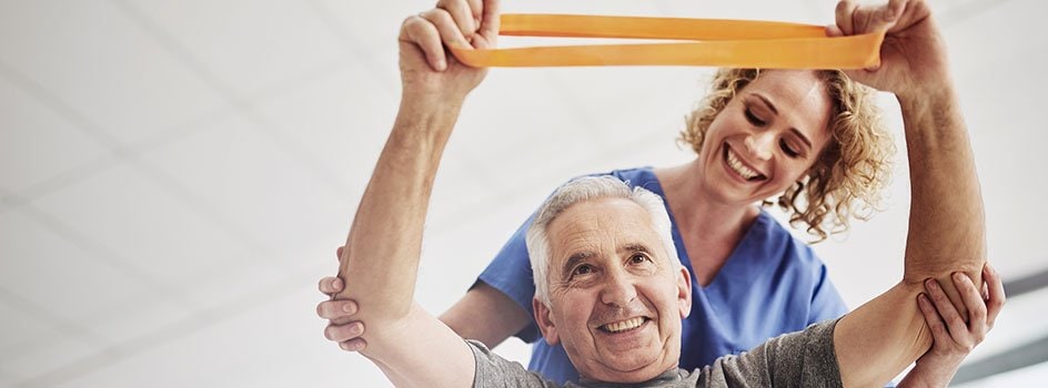 Man working with physical therapist