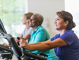 women exercising on equipment