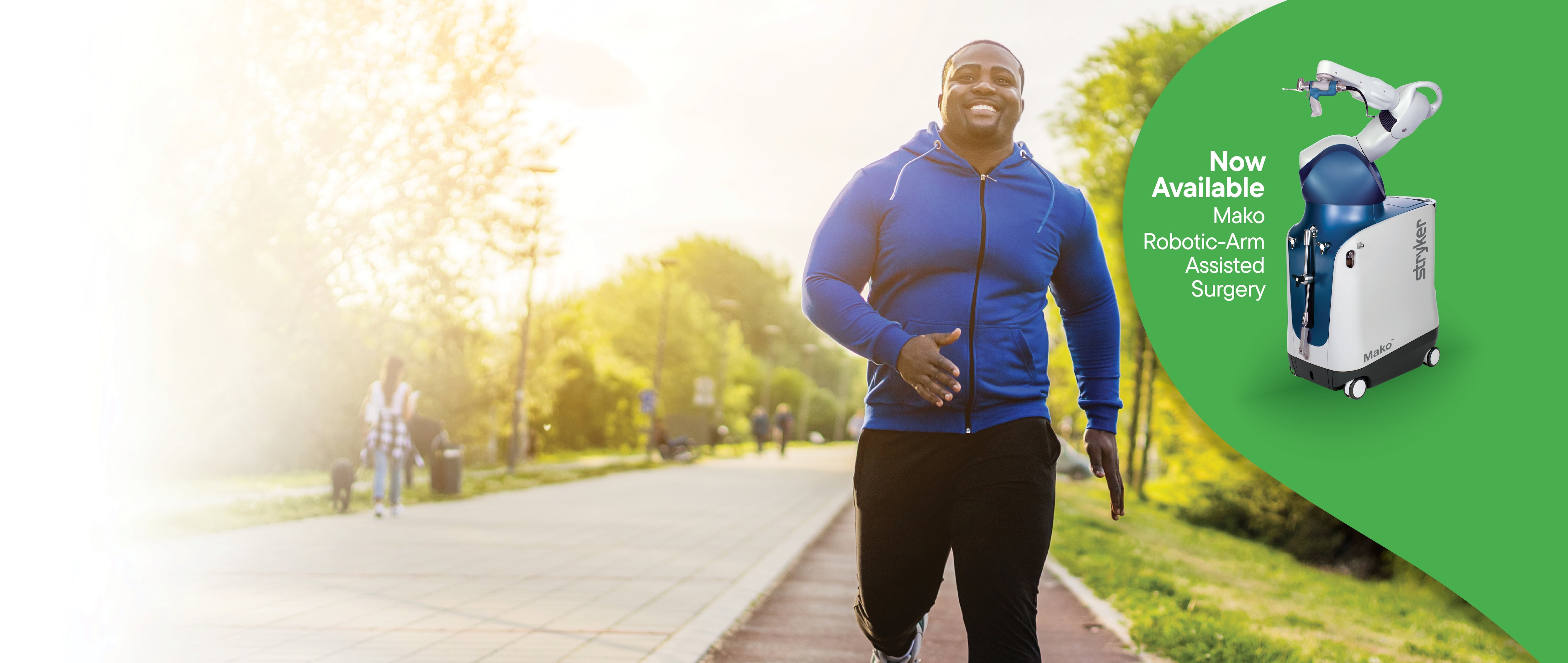 man jogging and Mako robotic arm