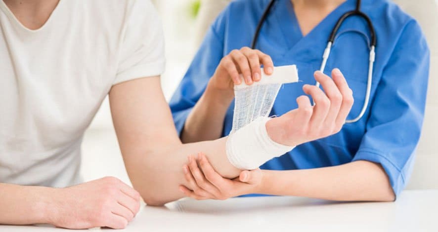 nurse applying bandage