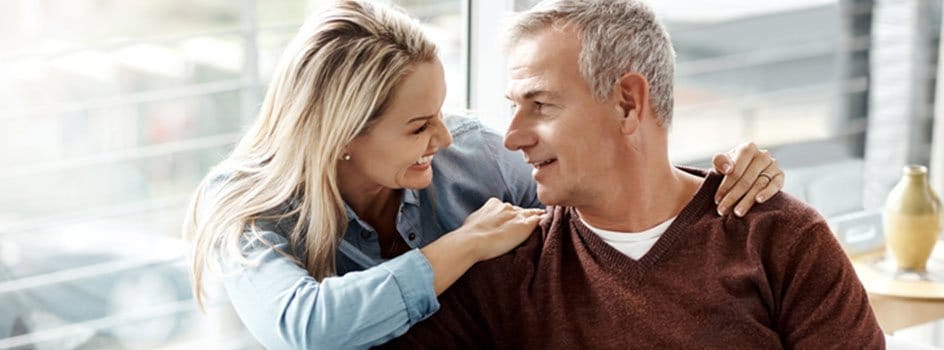 Woman smiling and looking at man