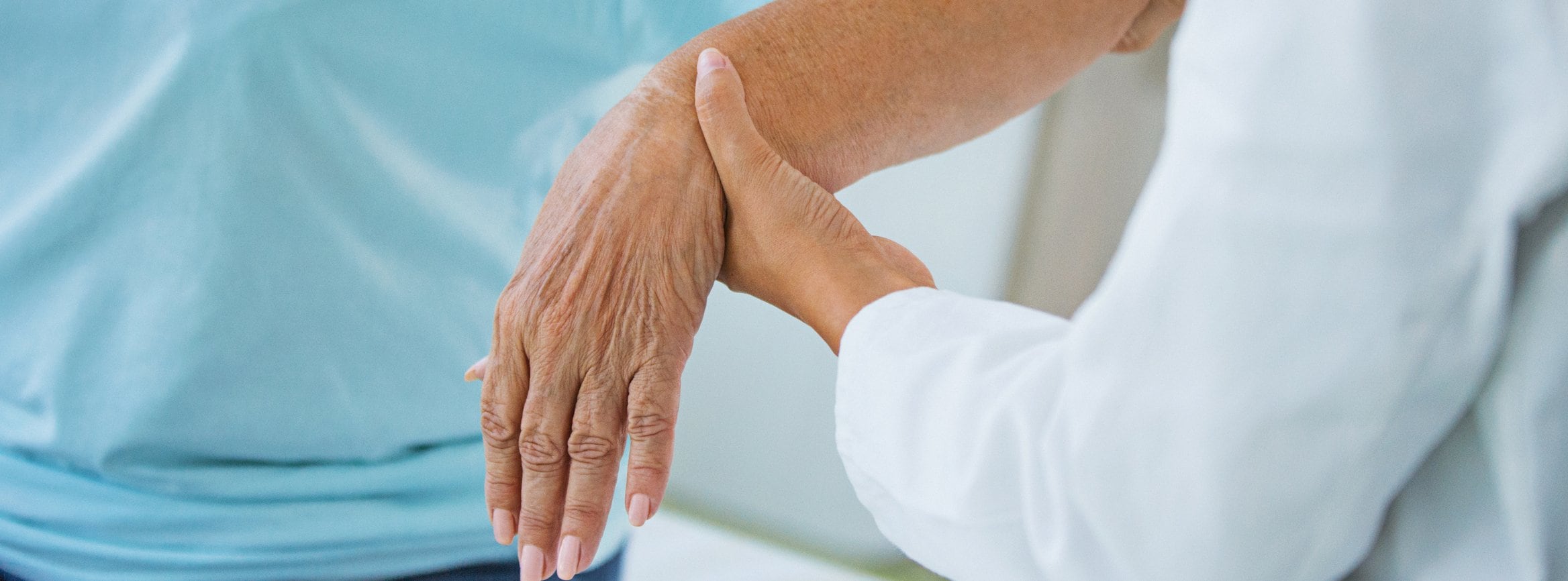 doctor holding patient wrist