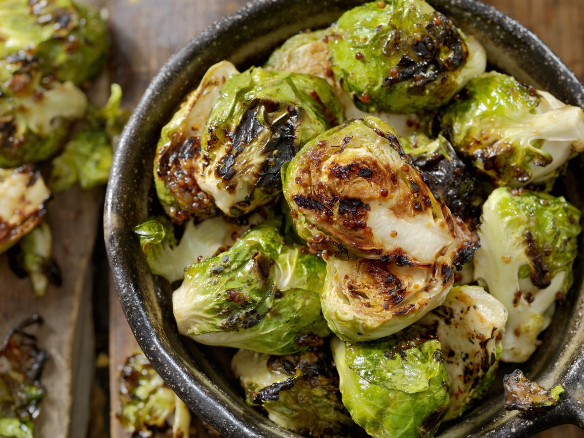 Brussels Sprouts in bowl with mustard dressing