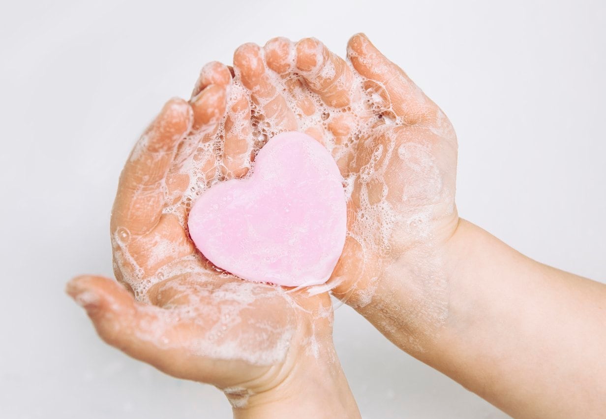 soapy hands holding heart