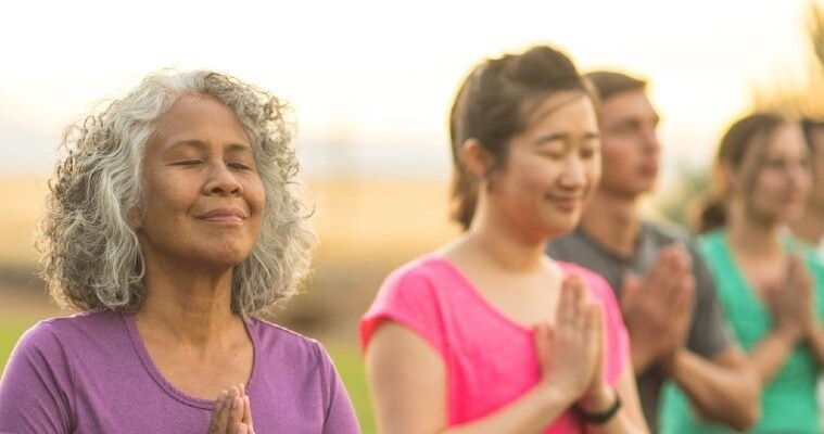 group of individuals meditating