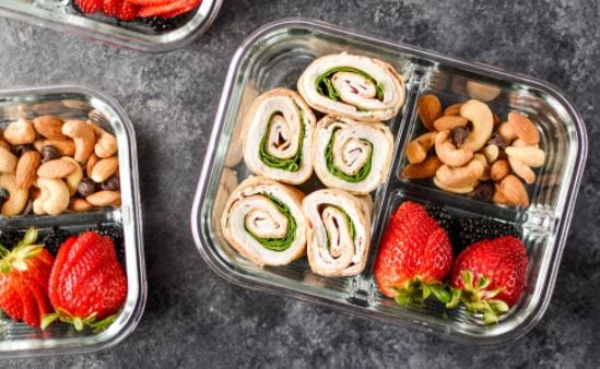 Turkey pinwheels served with healthy snacks