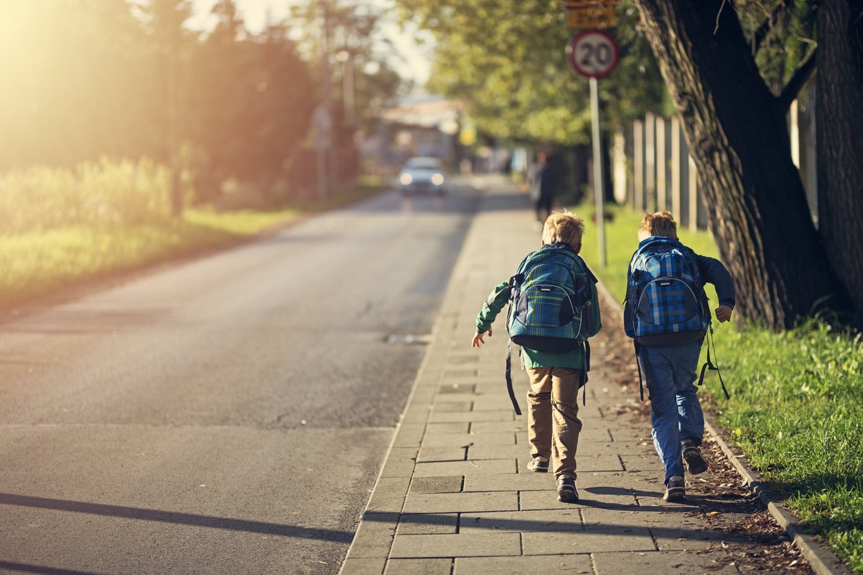 kids running with their backpacks