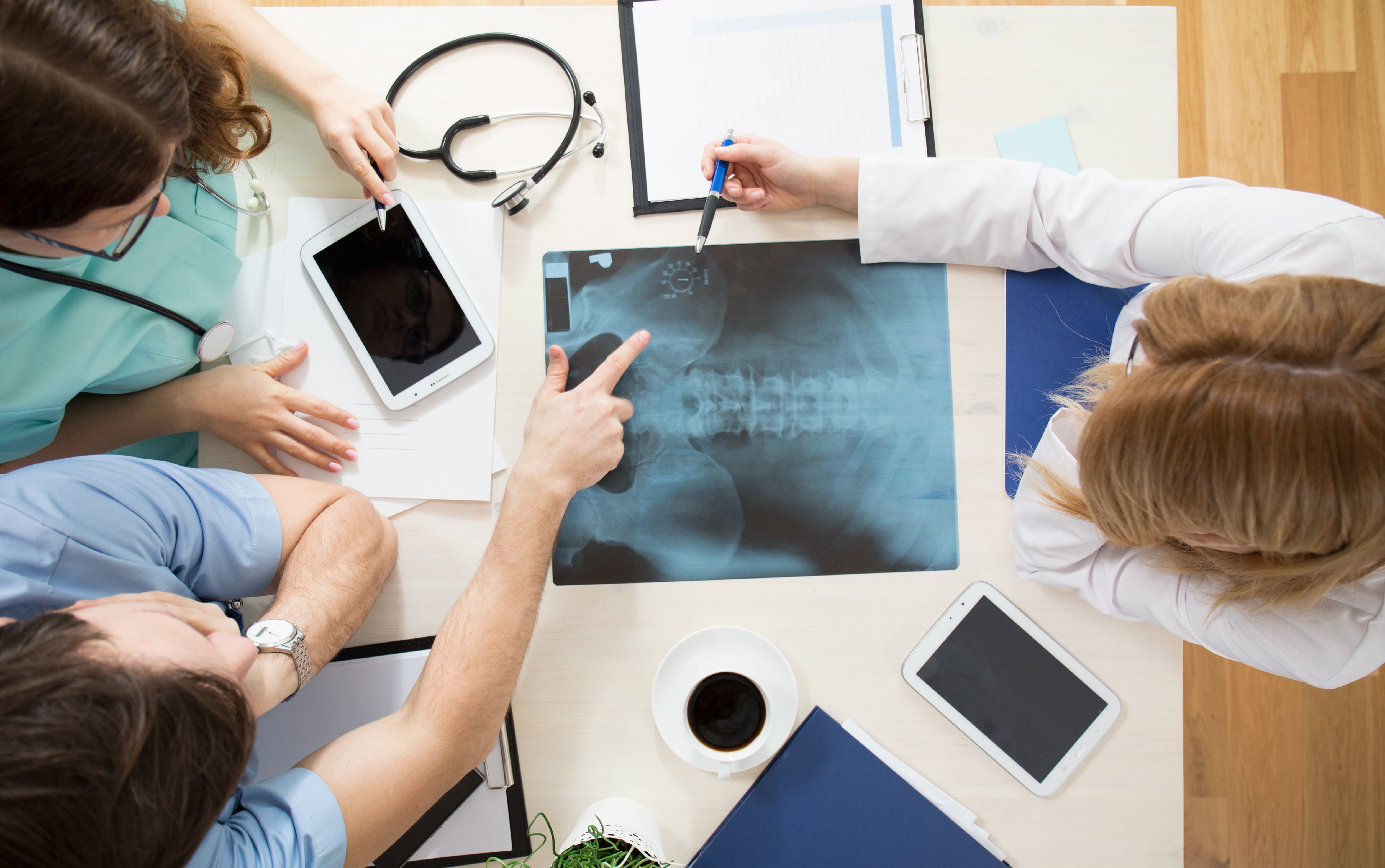 Doctors reviewing a orthopedic patient results